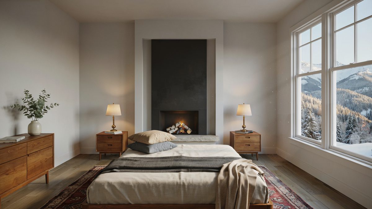 Dark recessed firebox on a plain column beside windows framing snowy mountains