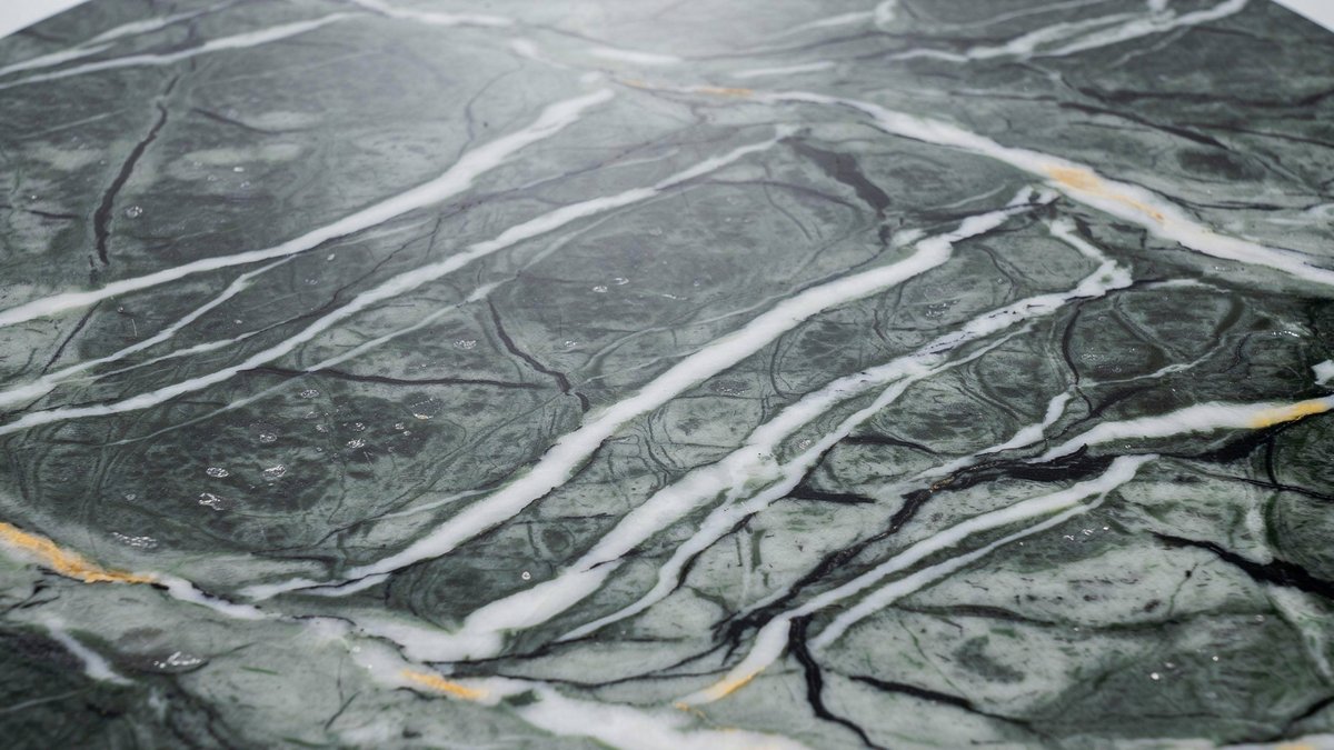 Gray green butterfly slab with white ribbon veining and thin gold streaks