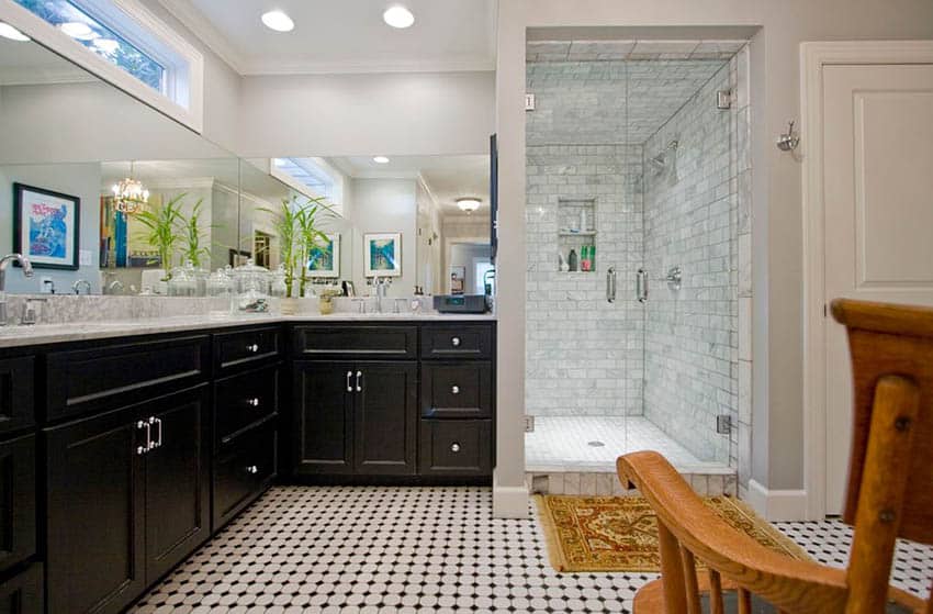 Contemporary bathroom with hinged shower doors dark vanity and penny tile