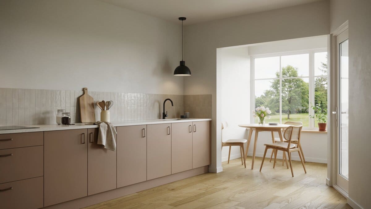 Brown flat panel cabinets meeting white Corian beside a sunlit breakfast nook