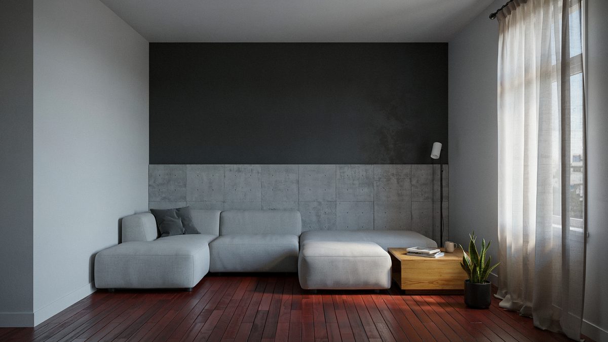 Room with red acacia floors, black wallpaper accent wall and square ottoman