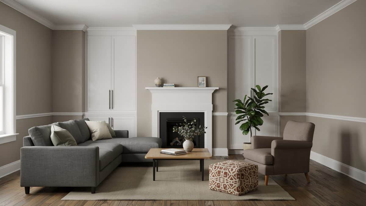Room with painted white mantel and modern section in gray linen
