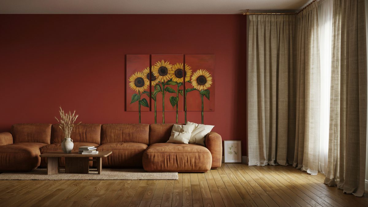 Room with wall art, red walls, couch sectional and curtains