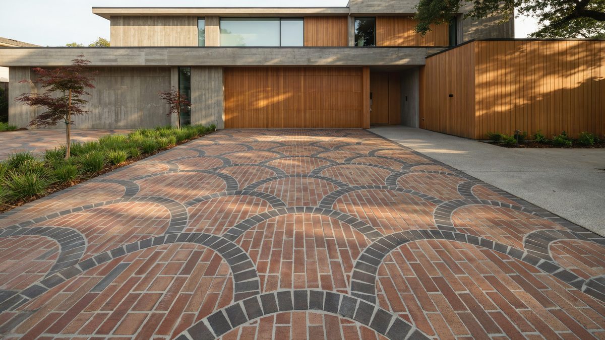 Brick driveway laid in an overlapping fan pattern with charcoal brick outlining each arc