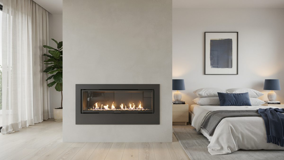 Wide linear firebox in a pale partition wall with navy pillows and framed art