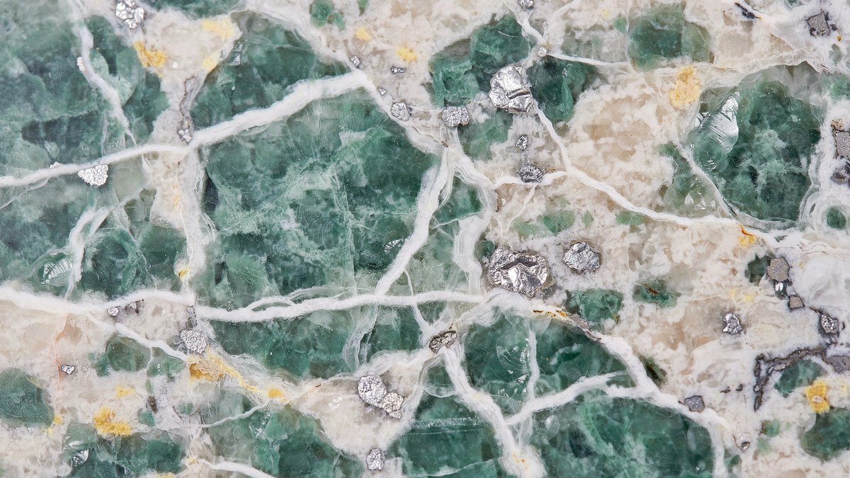 Crystallized silver sea slab blending jade patches with cream and gray minerals