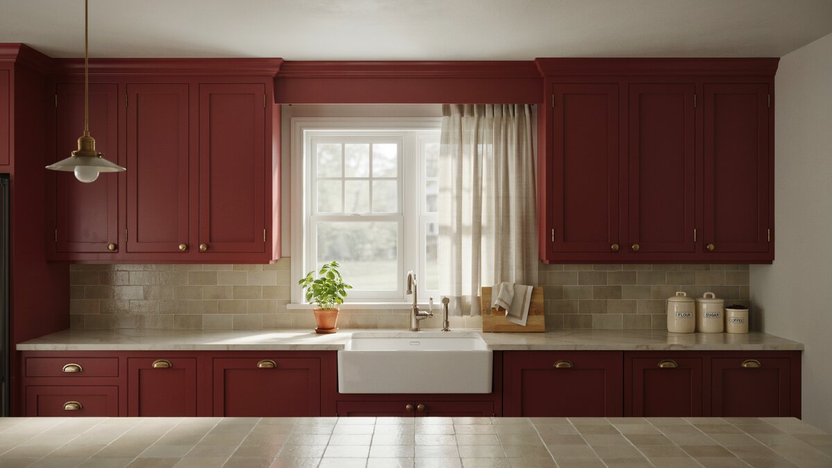 Dark red raised panel cabinets flanking a farmhouse sink beneath a curtained window