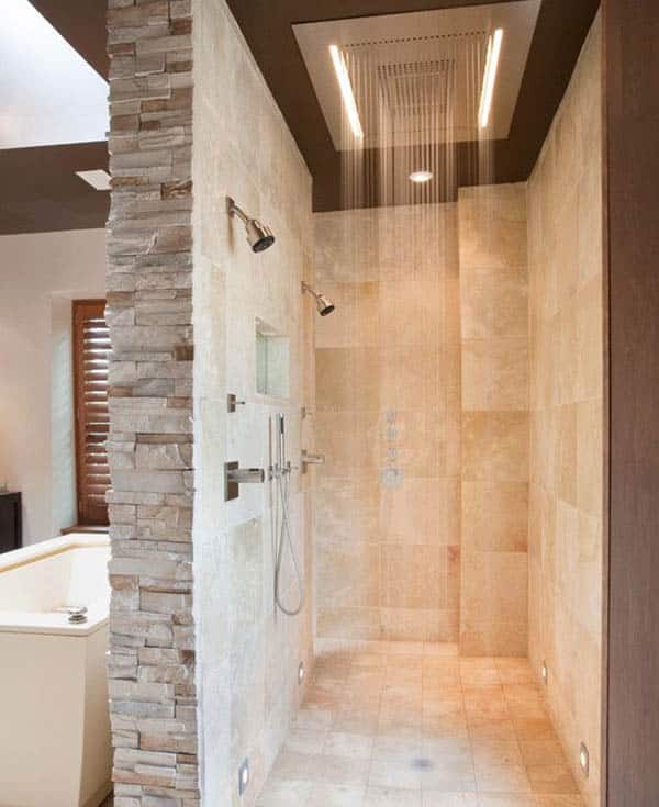 Stacked stone wall and shower with large rain head