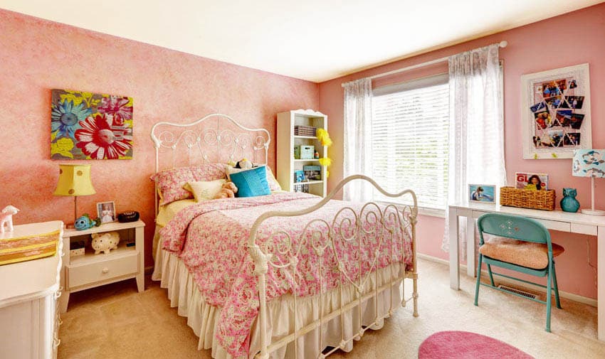Teen girl bedroom with white furniture and pink painted walls