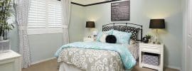teen-girls-bedroom-with-white-furniture-light-blue-walls