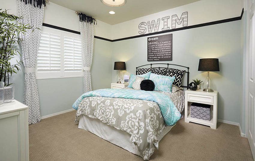 Teen girls bedroom with white furniture light blue walls