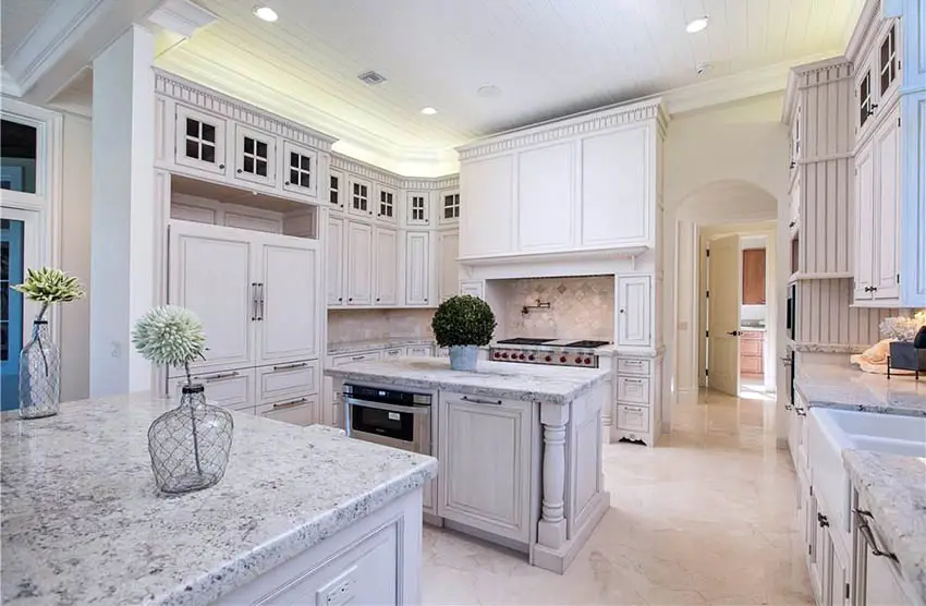 French style kitchen with salt and pepper style countertop made of granite