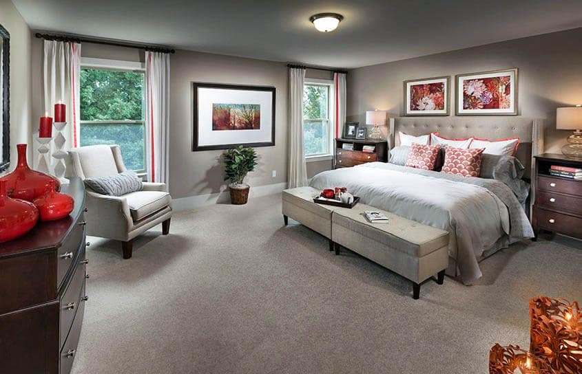 Contemporary bedroom with tufted bed and carpet