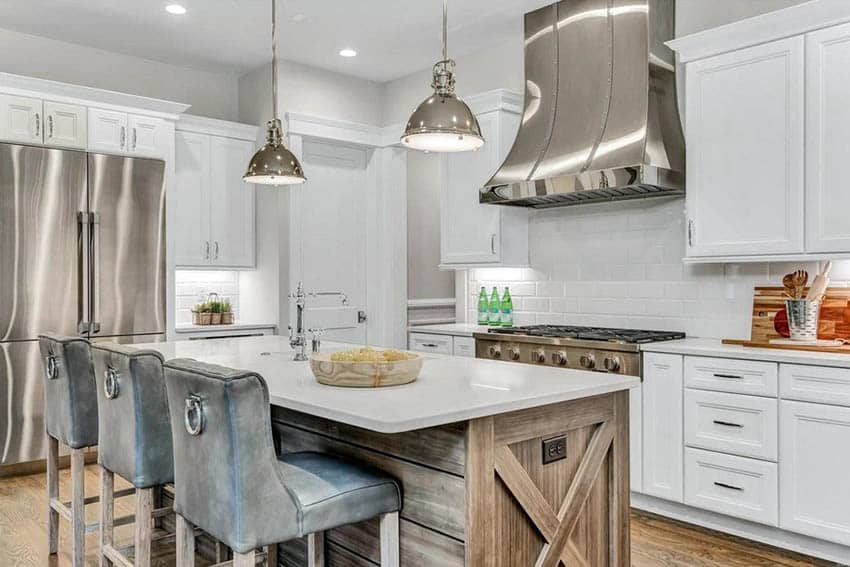 Corner kitchen with wood plank island and stone countertops