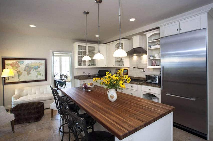 Kitchen with butcher block wood island and corner layout