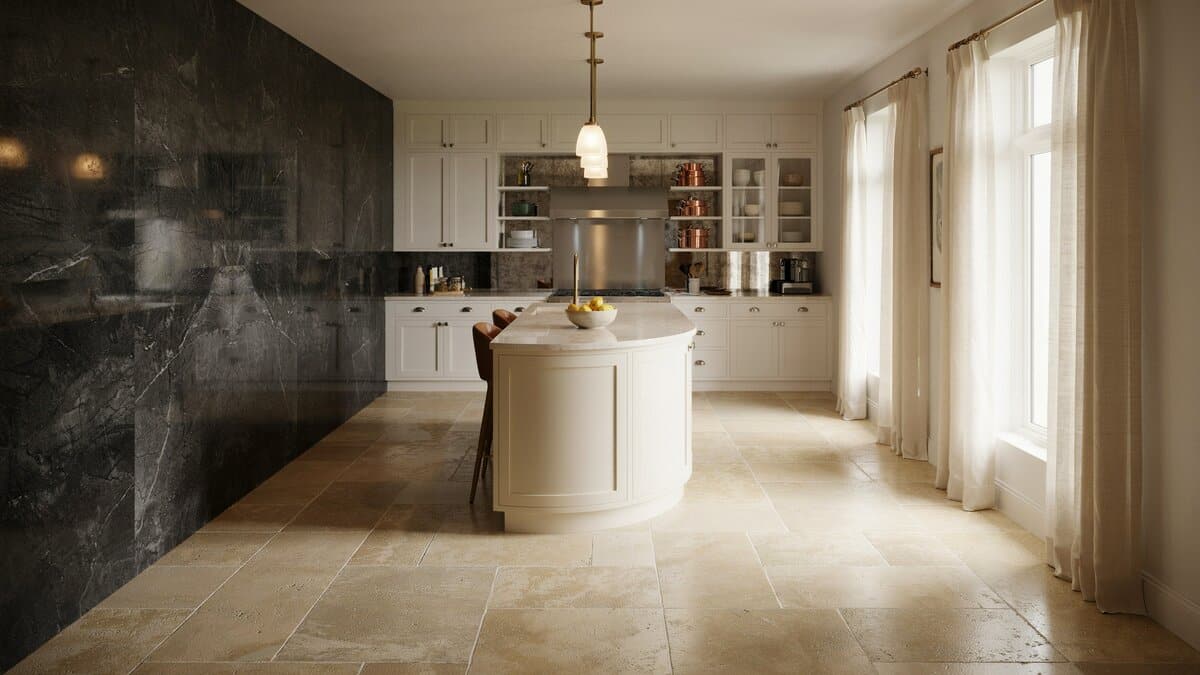 Full height dark granite slab wall beside a curved cream island and pendant