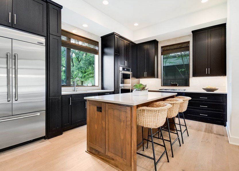 Kitchen design with black cabinets, light wood island quartz countertops