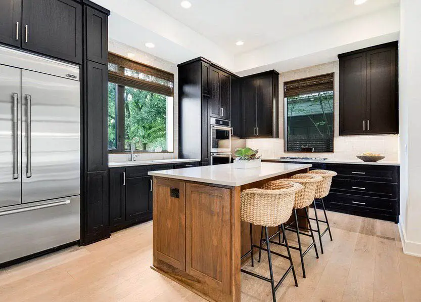 L shaped kitchen design with black cabinets light wood island quartz countertops