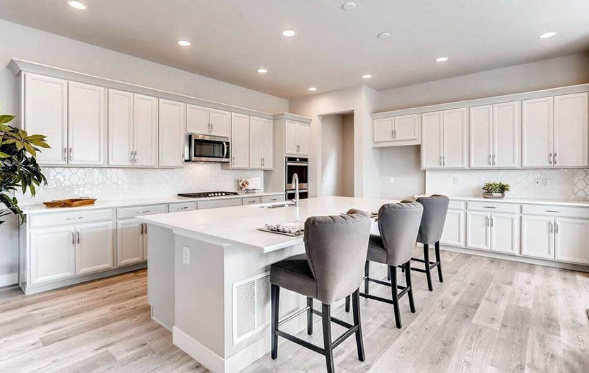 Large open kitchen with eat-in island and octagon tile backsplash