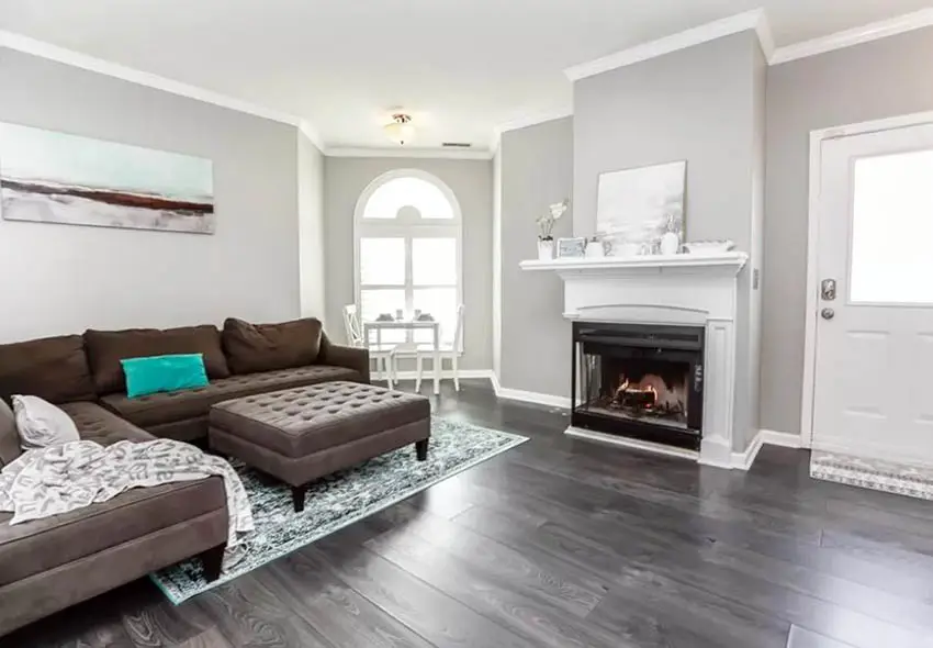 gray living room with brown leather furniture