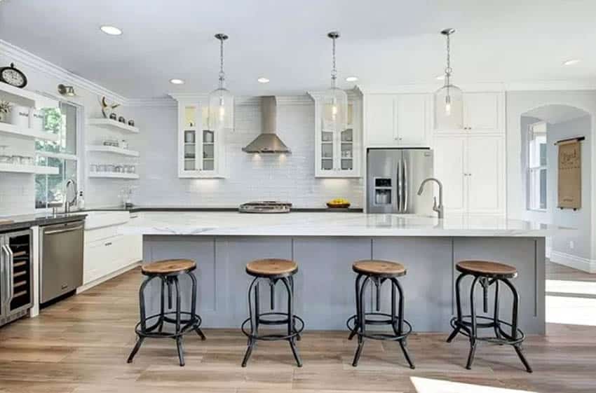 Luxury l shaped kitchen with long gray island white cabinets marble countertops