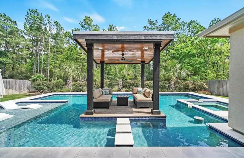 Luxury wood deck island over pool with cabana