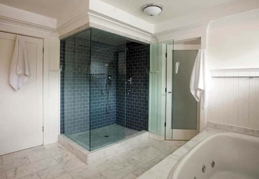 Master bathroom with calacatta gold honed marble floors and subway tile shower Master bathroom with calacatta gold honed marble floors and subway tile shower