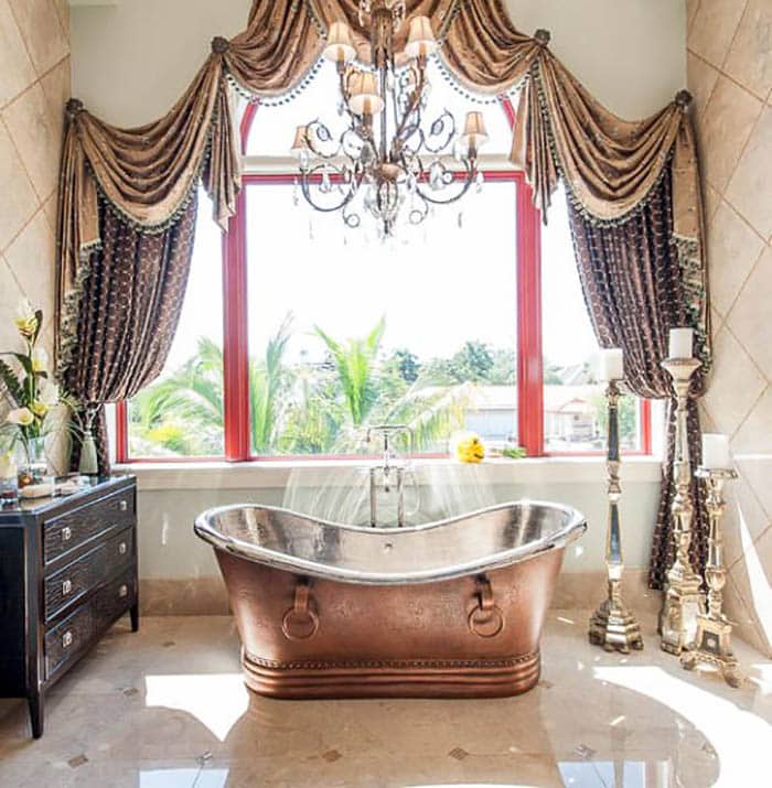 Master bathroom with cappuccino polished marble floor and copper bathtub Master bathroom with cappuccino polished marble floor and copper bathtub