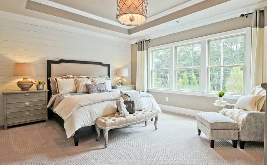 Master bedroom with beige wall and ceiling paint with white molding