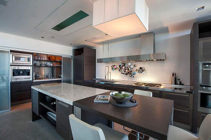 Modern custom kitchen with rectangular island with two types of countertops