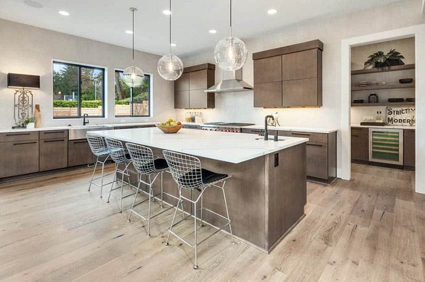 Modern kitchen with pantry area and slab cabinets