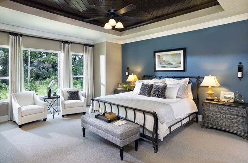 Relaxing master bedroom with mountain stream blue accent wall