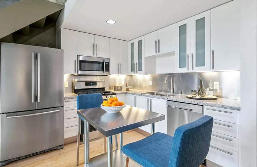 Small modern floor plan kitchen with stainless steel table island