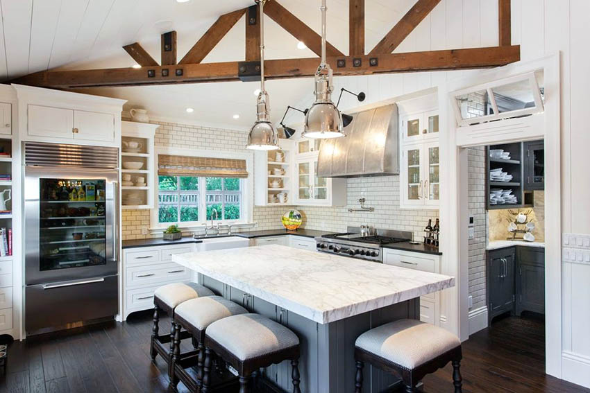 Traditional island, subway tile backsplash, shaker cupboards and butlers pantry