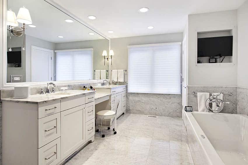 Traditional master bathroom with carrara marble flooring shower and alcove tub