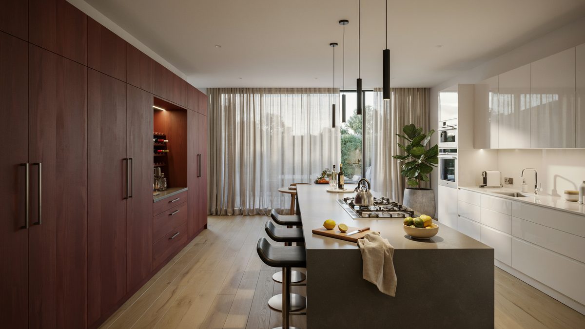 Deep red floor to ceiling cabinets facing a white run with a dark island cooktop