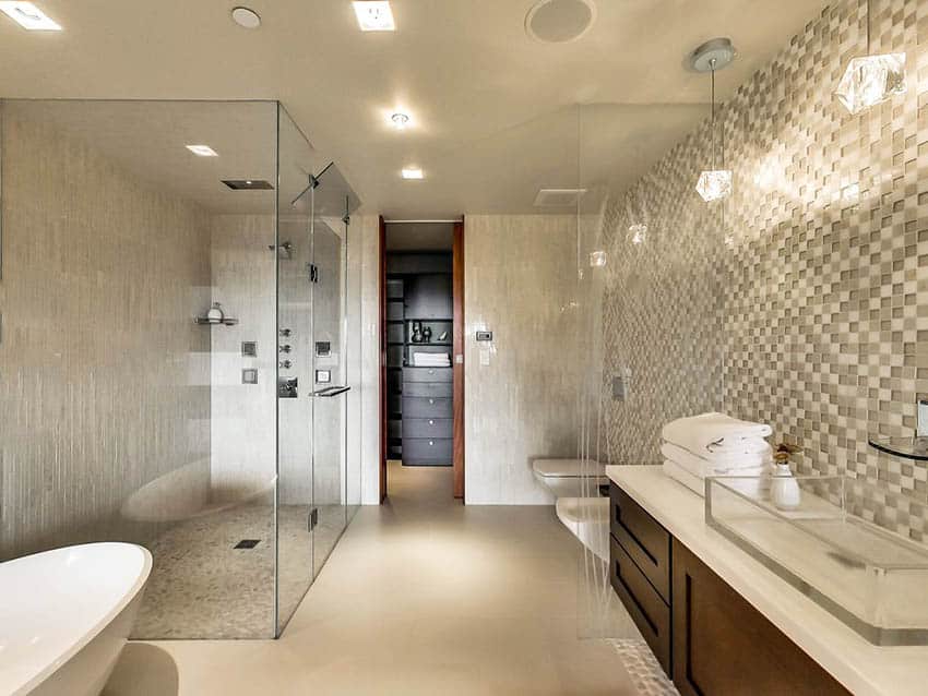 Bathroom with frameless shower with multiple shower heads