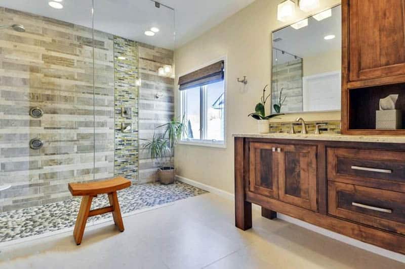 Walk-in bathroom shower with river rock flooring