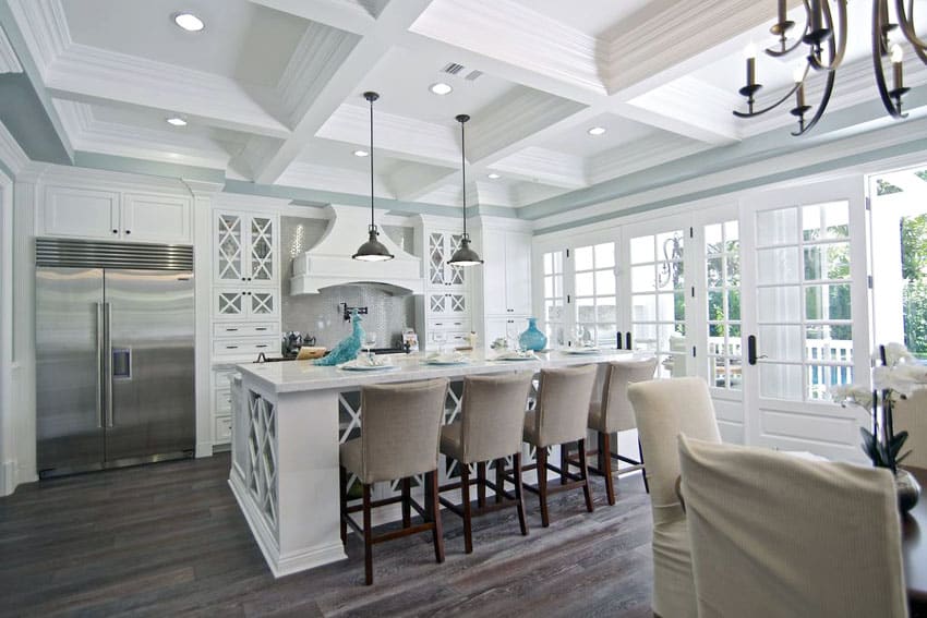 Beautiful kitchen with white doors box ceiling and marble island