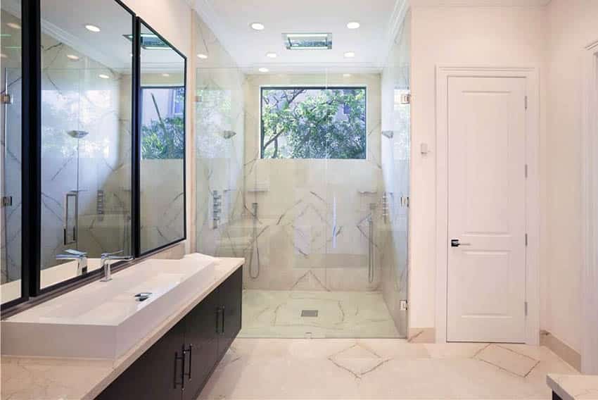 Contemporary master bathroom with white quartz and rain shower head