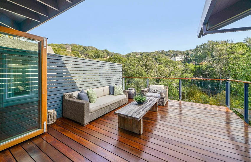 Contemporary wood deck with horizontal fence and glass railing