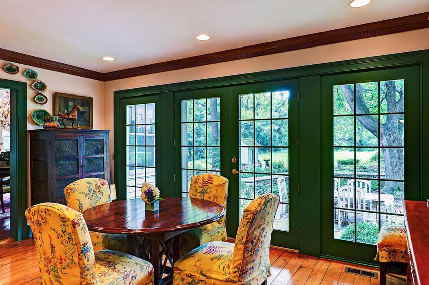 Dining room with green french doors
