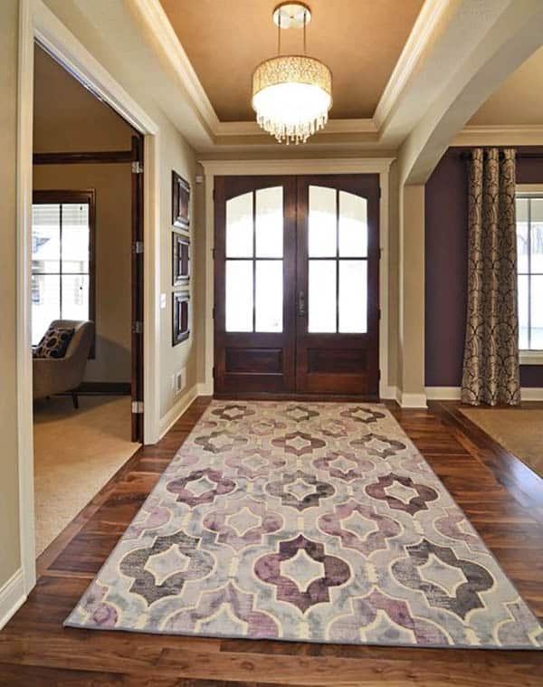 Foyer with double door, drum chandelier, carpet and curtains