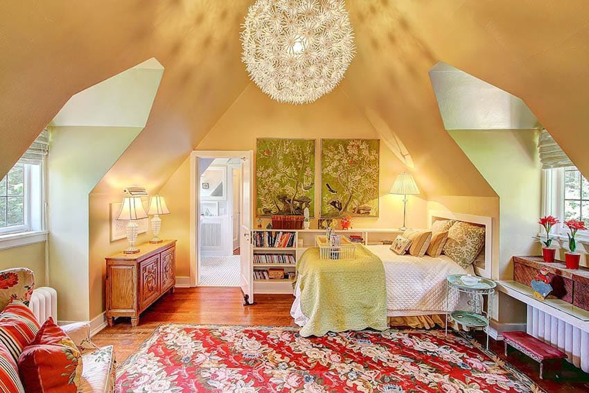 Kids attic bedroom with built in bookshelf and dormer windows