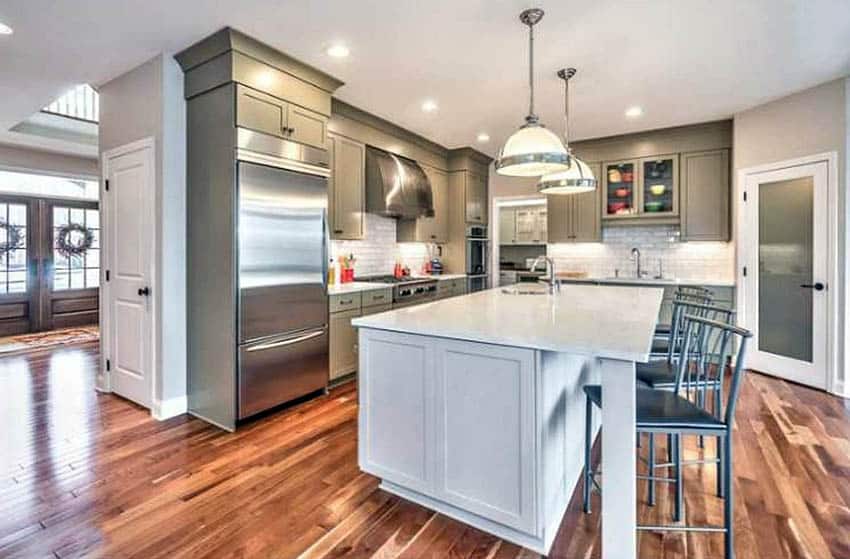 Kitchen With American Cherry Wood Flooring And Green Cabinets 