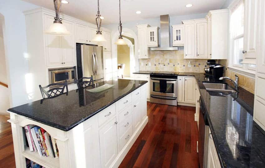 Kitchen with jatoba floors and white painted cabinets with black granite