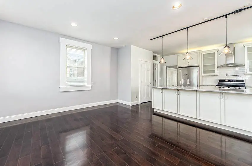 Living Room With Walnut Floors And Gray Paint .webp