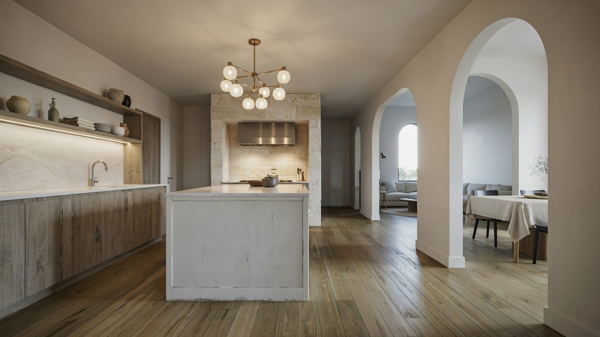 Stone clad walls with an aged white island and thick white quartz counters