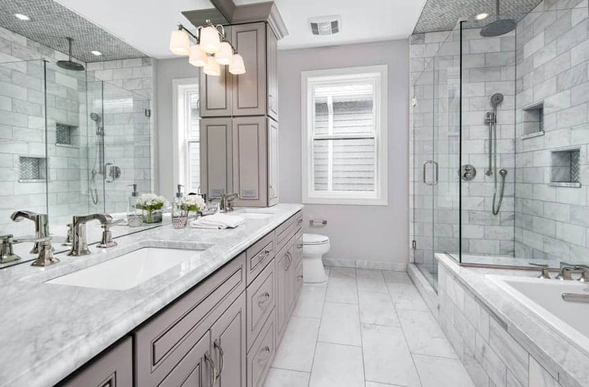 Master bathroom with calacatta gold marble countertop vanity and carrara subway tile in shower