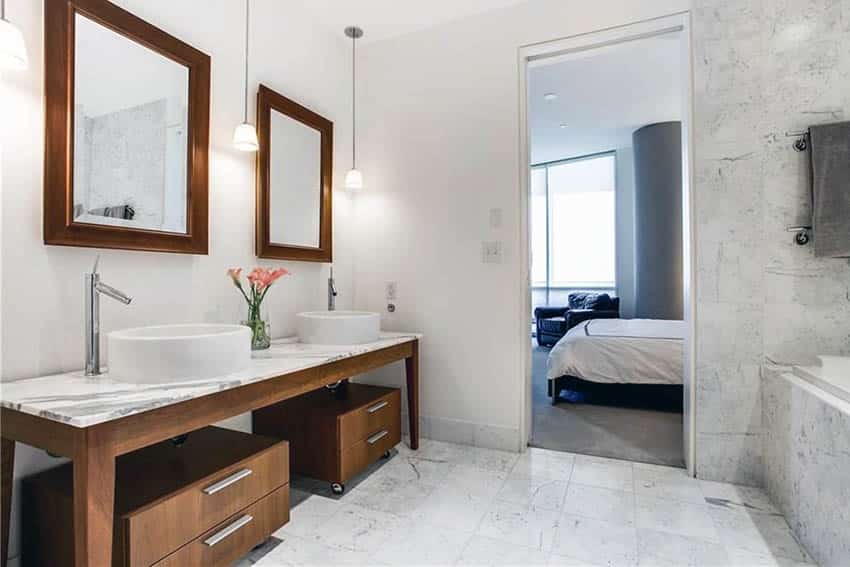Master bathroom with marble countertops and dual vessel sinks